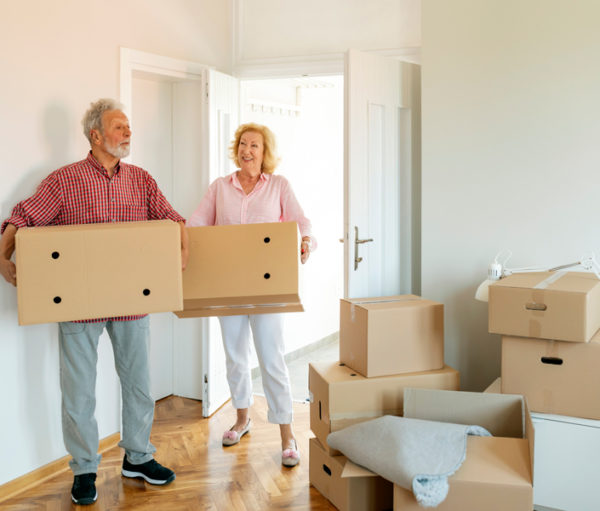 Older couple with moving boxes