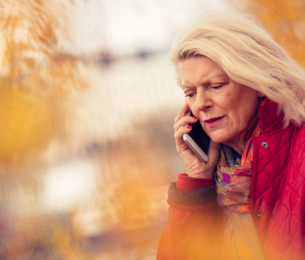 Distressed woman on cell phone